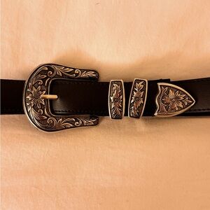 Floral silver buckled black belt